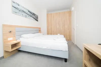 Łóżko lub łóżka w pokoju w obiekcie VacationClub - Aparthotel Czarna Góra 413