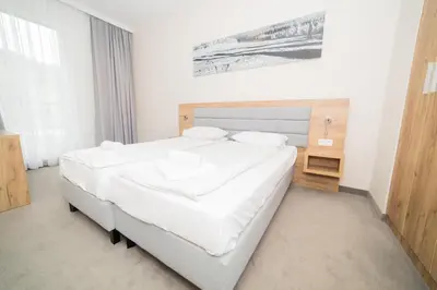Łóżko lub łóżka w pokoju w obiekcie VacationClub - Aparthotel Czarna Góra 413