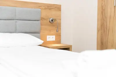 Łóżko lub łóżka w pokoju w obiekcie VacationClub - Aparthotel Czarna Góra 413