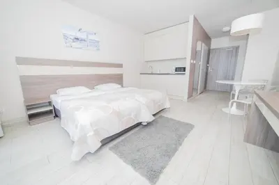 Łóżko lub łóżka w pokoju w obiekcie VacationClub - Bormio Apartament 8