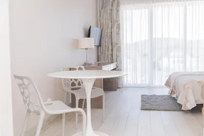 Łóżko lub łóżka w pokoju w obiekcie VacationClub - Bormio Apartament 8