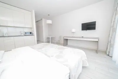 Łóżko lub łóżka w pokoju w obiekcie VacationClub - Bormio Apartament 8