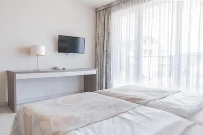 Łóżko lub łóżka w pokoju w obiekcie VacationClub - Bormio Apartament 8