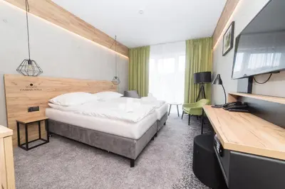 Łóżko lub łóżka w pokoju w obiekcie VacationClub - Czarna Perła Apartament 303