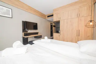 Łóżko lub łóżka w pokoju w obiekcie VacationClub - Czarna Perła Apartament 303