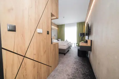 Łóżko lub łóżka w pokoju w obiekcie VacationClub - Czarna Perła Apartament 303