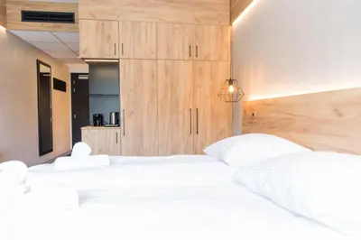 Łóżko lub łóżka w pokoju w obiekcie VacationClub - Czarna Perła Apartament 303