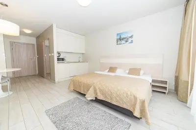 Łóżko lub łóżka w pokoju w obiekcie VacationClub - Solden Apartament 14