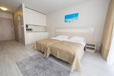 Łóżko lub łóżka w pokoju w obiekcie VacationClub - Solden Apartament 18