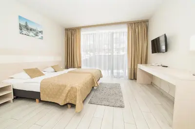 Łóżko lub łóżka w pokoju w obiekcie VacationClub - Solden Apartament 29
