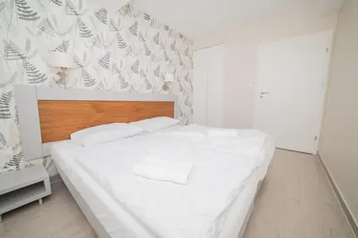Łóżko lub łóżka w pokoju w obiekcie VacationClub - Stubai Apartament 16