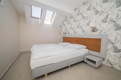 Łóżko lub łóżka w pokoju w obiekcie VacationClub - Stubai Apartament 26