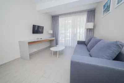 Telewizja i/lub zestaw kina domowego w obiekcie VacationClub - Stubai Apartament 26