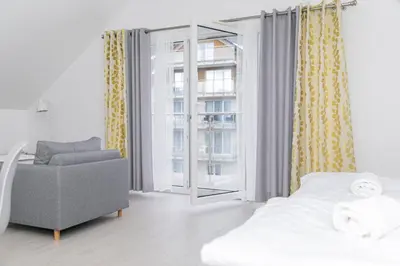 Łóżko lub łóżka w pokoju w obiekcie VacationClub - Stubai Apartament 38