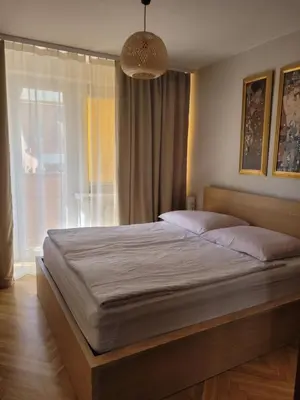 Łóżko lub łóżka w pokoju w obiekcie Apartament przy Rynku z garażem