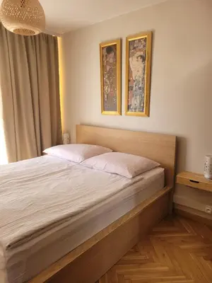 Łóżko lub łóżka w pokoju w obiekcie Apartament przy Rynku z garażem