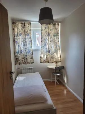 Łóżko lub łóżka w pokoju w obiekcie Apartament przy Rynku z garażem
