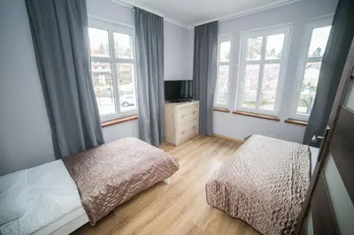 Łóżko lub łóżka w pokoju w obiekcie VacationClub - Bystrzycka Apartament 2