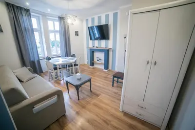 Telewizja i/lub zestaw kina domowego w obiekcie VacationClub - Bystrzycka Apartament 2