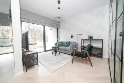 Telewizja i/lub zestaw kina domowego w obiekcie VacationClub – Ogrody Pieniawskie Apartament 21