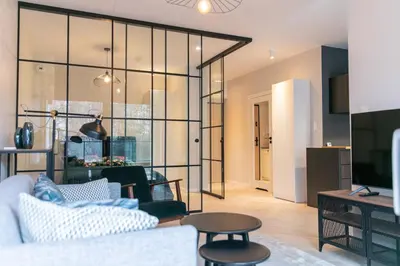 Telewizja i/lub zestaw kina domowego w obiekcie VacationClub – Ogrody Pieniawskie Apartament 21