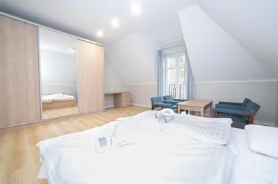 Łóżko lub łóżka w pokoju w obiekcie VacationClub - Zdrojowa 7 Apartament 7