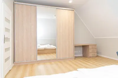 Łóżko lub łóżka w pokoju w obiekcie VacationClub – Zdrojowa 7 Apartament 9