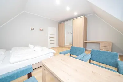 Łóżko lub łóżka w pokoju w obiekcie VacationClub – Zdrojowa 7 Apartament 9