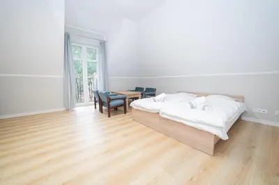 Łóżko lub łóżka w pokoju w obiekcie VacationClub - Zdrojowa 7 Apartament 10