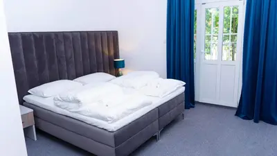 Łóżko lub łóżka w pokoju w obiekcie Bon Żur