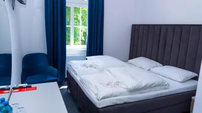 Łóżko lub łóżka w pokoju w obiekcie Bon Żur
