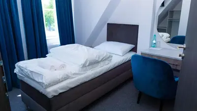 Łóżko lub łóżka w pokoju w obiekcie Bon Żur
