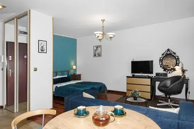 Telewizja i/lub zestaw kina domowego w obiekcie Cozy Apartment