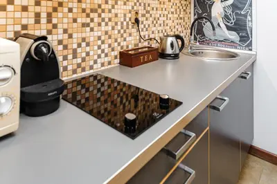 Kuchnia lub aneks kuchenny w obiekcie Cozy Apartment