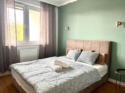Łóżko lub łóżka w pokoju w obiekcie Gold Sleep nowy apartament z jacuzzi na wyłączność