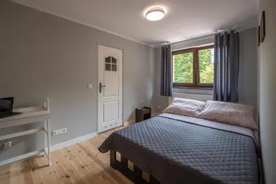 Łóżko lub łóżka w pokoju w obiekcie Górskie Klimaty