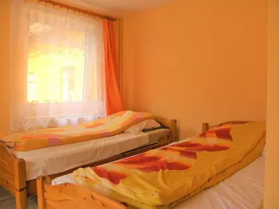 Łóżko lub łóżka w pokoju w obiekcie Dom Turysty Pod Wieżycą