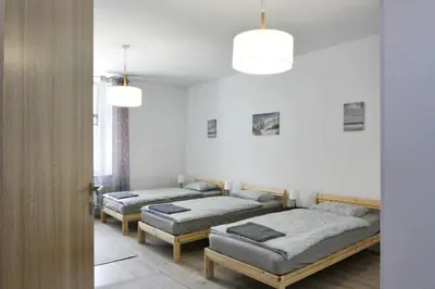 Łóżko lub łóżka w pokoju w obiekcie Apartament Piwna 13