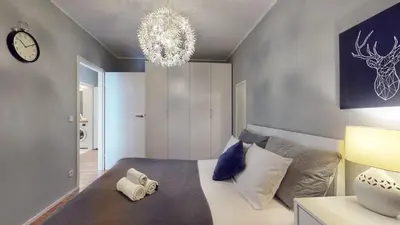Łóżko lub łóżka w pokoju w obiekcie Kurkowa 14 Tectum Apartments