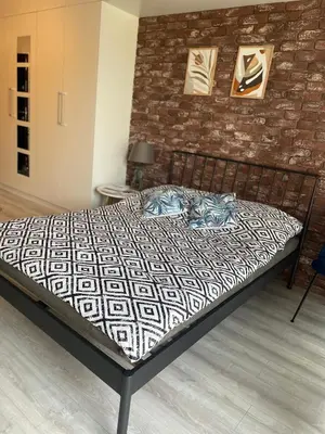 Łóżko lub łóżka w pokoju w obiekcie Apartamet Poezji A04 Blue