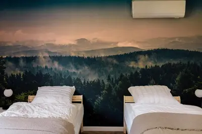 Łóżko lub łóżka w pokoju w obiekcie Apartamenty Koziołek
