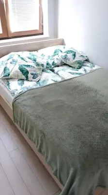 Łóżko lub łóżka w pokoju w obiekcie Apartament Zalesie z tarasem