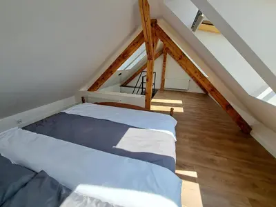 Łóżko lub łóżka w pokoju w obiekcie PIASTA STREET APARTMENT