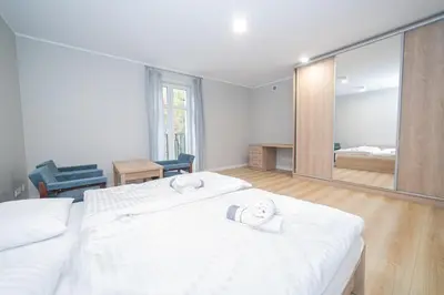 Łóżko lub łóżka w pokoju w obiekcie VacationClub – Zdrojowa 7 Apartament 6