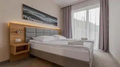 Łóżko lub łóżka w pokoju w obiekcie VacationClub - Aparthotel Czarna Góra 201