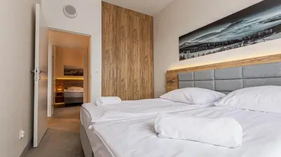Łóżko lub łóżka w pokoju w obiekcie VacationClub - Aparthotel Czarna Góra 201