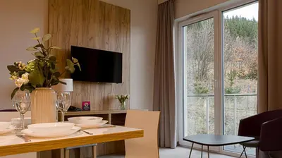 Telewizja i/lub zestaw kina domowego w obiekcie VacationClub - Aparthotel Czarna Góra 201