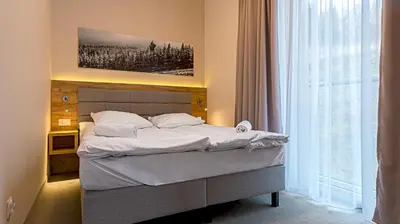 Łóżko lub łóżka w pokoju w obiekcie VacationClub - Aparthotel Czarna Góra 201