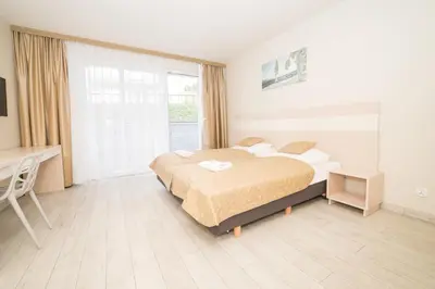 Łóżko lub łóżka w pokoju w obiekcie VacationClub - Ischgl Apartament 19