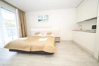 Łóżko lub łóżka w pokoju w obiekcie VacationClub - Ischgl Apartament 19